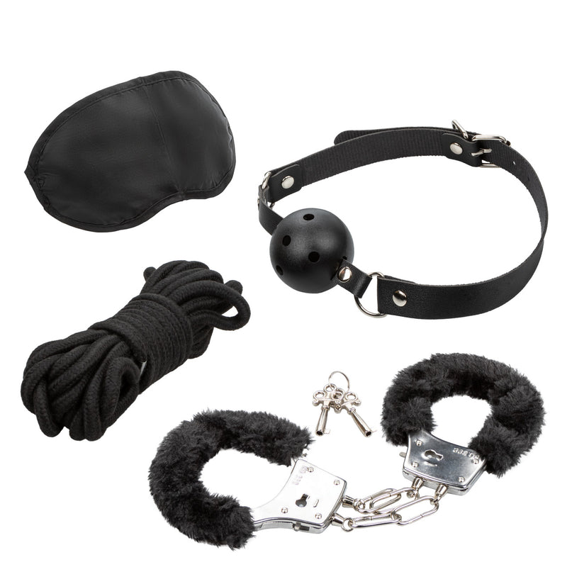 Pleasure Kits Explorer Collection Black bondage kit including a ball gag, cuffs, rope, and blindfold.