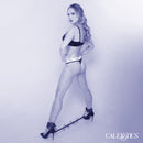 Model showcasing the Nocturnal Collection Spreader Bar with Cuffs for restraint play and enhanced control.