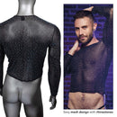 Radiance long sleeve shirt with mesh design and rhinestone accents, showcased by a model against a brick wall background.