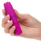 Hand holding Kyst Mega-Mite Pink 10 Function Rechargeable Mini Wand Vibrator with compact design for versatile pleasure.