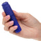 Hand holding Kyst Mega-Mite Purple rechargeable bullet vibrator with interchangeable silicone tips for customizable pleasure.