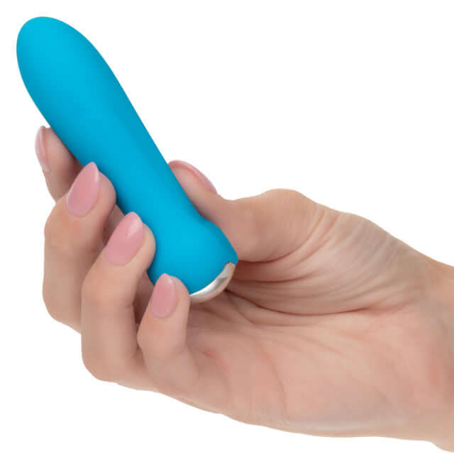 Hand holding Kyst Rocket 10 Function Rechargeable Mini Bullet Vibrator in blue, showcasing its compact and discreet design.