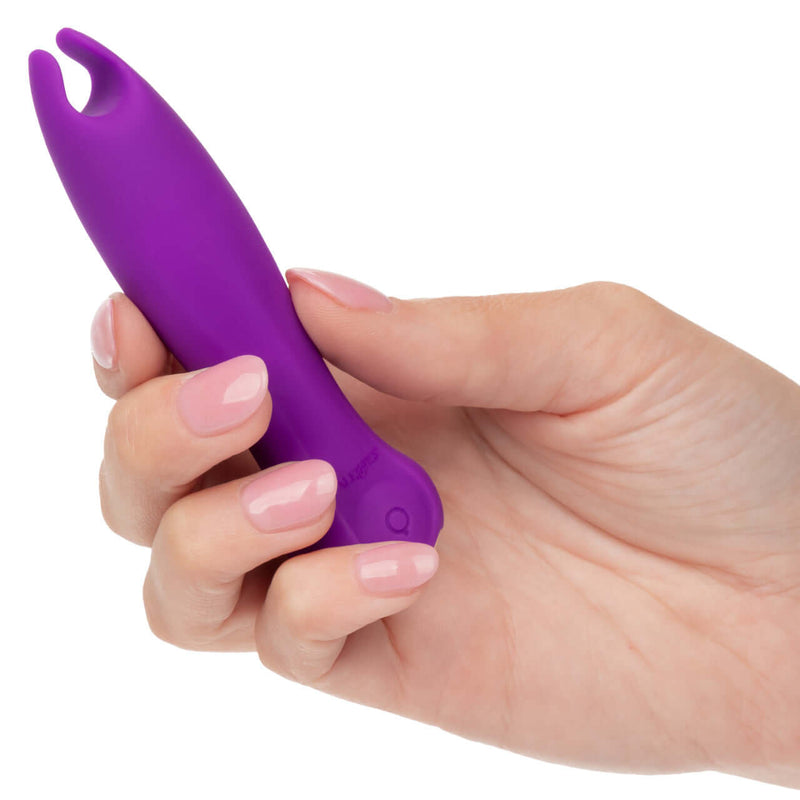 Compact purple Kyst Teaser Flickering Bullet Vibrator held in hand, showcasing its small and travel-friendly design.