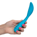 Woman holding California Dreaming Palm Springs Pleaser in Blue by CalExotics showing its flexible body and vibration controls