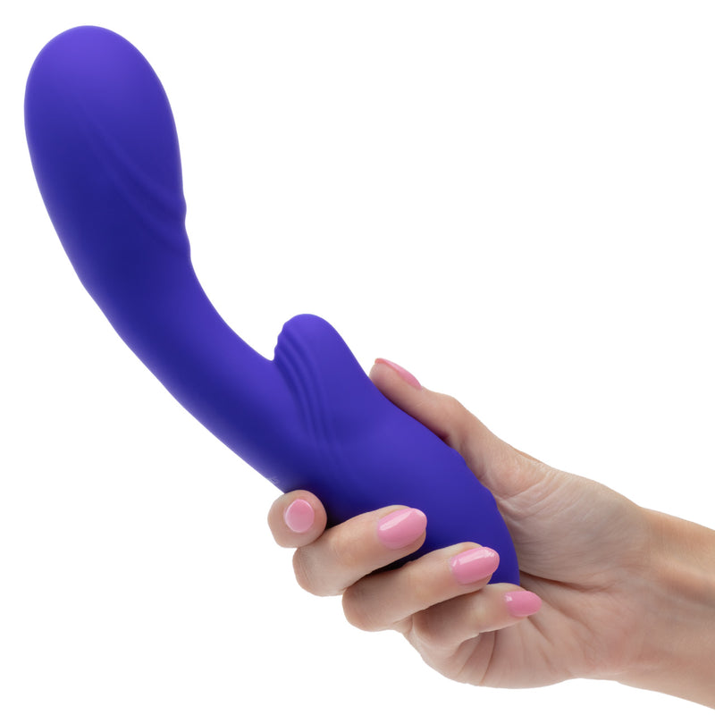 Rumbler Rumble G Rechargeable Silicone Dual Vibrator Purple held in hand showcasing its design and features.