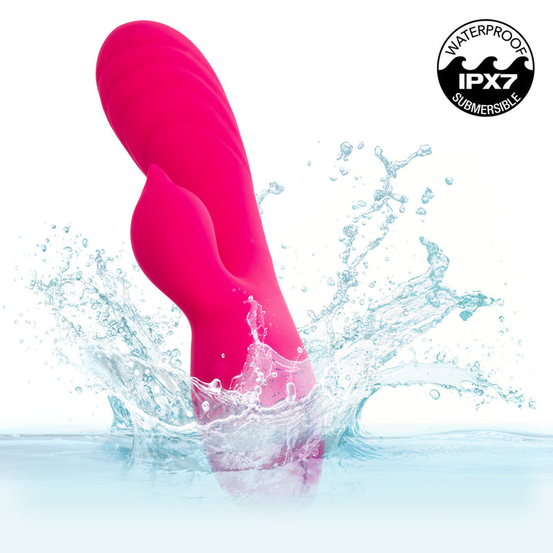 Rumbler Rumble Duo Silicone Rabbit Vibrator Pink splashing in water, showcasing waterproof feature, designed for ultimate pleasure.