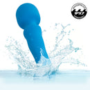 Rumbler Rumble Wand Rechargeable Silicone Vibrator Blue splashing in water, showcasing waterproof features.