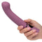 Person holding Orgasmatron Digital G-Wand angled wand massager with 10 vibration modes for precise stimulation and ultimate pleasure.