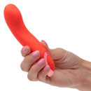 A hand holding the Kroma Turbo Curve Vibrator, a sleek mini massager designed for targeted stimulation.