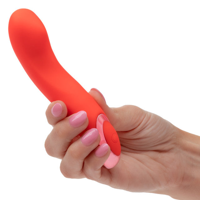 A hand holding the Kroma Turbo Curve Vibrator, a sleek mini massager designed for targeted stimulation.