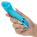 Kroma Turbo Exciter Rechargeable Mini Massager Blue held in hand, showcasing its ergonomic design and sleek appearance.