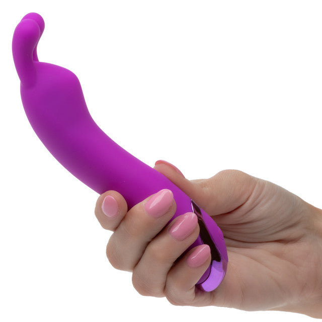 A hand holding the Kroma Turbo Bunny Vibrator Purple showcasing its sleek design and flexible ears.