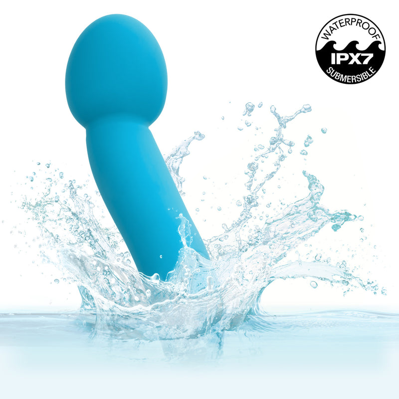 Kroma Turbo G Vibrator Blue splashing in water, showcasing its waterproof design and smooth silicone texture.