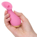 Hand holding the Slay Tickle Me Pink Petite Arouser, a compact pleasure device designed for targeted stimulation.
