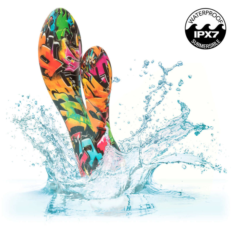 Vibrant Hype Dual Stim 10-Speed Dual Vibrator with graffiti design splashing in water, IPX7 waterproof and submersible.