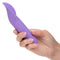 Person holding the Dr. Laura Berman Rechargeable Flutter Vibrator, a luxurious purple massager with a 10-speed flickering teaser.