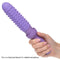 Person holding Dr. Laura Berman Rechargeable Dilator with silicone textured sleeve for added sensations.
