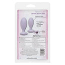 Packaging for First Time Crystal Booty Duo Silicone Anal Plug set, featuring 2 smooth, purple plugs with heart crystal accents.