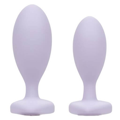First Time Crystal Booty Duo silicone anal plugs in purple, featuring graduated sizes and a smooth design.