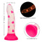Glow Stick Heart Dildo with glow-in-the-dark heart pattern, shown with dimensions and sturdy suction cup base. Made of Satin Finish Silicone.