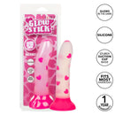 Glow Stick Heart Dildo in packaging with glow-in-the-dark heart pattern and suction cup base, made from soft silicone, fits most harnesses.