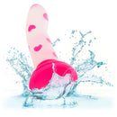 Glow Stick Heart Dildo with pink heart pattern and splash of water, made of soft Satin Finish Silicone, glowing in the dark.
