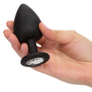 Silicone Gem Anal Kit Black showcased with a hand holding the black silicone anal plug featuring a decorative gem.