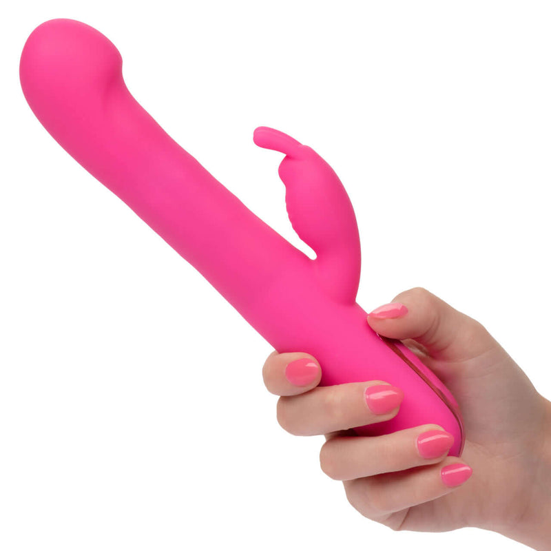 Pink Jack Rabbit Elite Beaded G Rabbit vibrator held in hand, featuring G-spot stimulation and clitoral teaser.