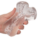 Clear Cyclone Dual Chamber Stroker held in hand, designed for enhanced pleasure and comfort.