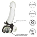 Silicone Ball Spreader Black on a clear dildo, showcasing its stretchy design and independent scrotum rings for support.