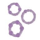 Trio of stretchy purple cock rings in small, medium, and large sizes by California Exotic Novelties for prolonged performance and heightened pleasure