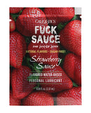 Fuck Sauce Flavored Water Based Lubricant Sachet Strawberry packaging on a strawberry background