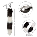 Running Wild Black and White Tail Butt Plug with luxurious fur tail and smooth metallic probe for intimate pleasure.