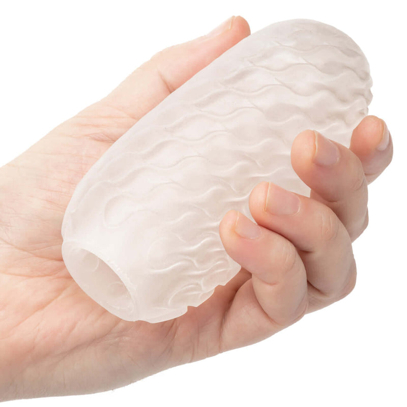Boundless Reversible Squishy Ball Stroker in hand, showcasing its soft and stretchy design for enhanced pleasure.