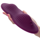 CalExotics Lust Remote Controlled Dual Rider Vibrator in hand, showcasing its contoured design for pleasure.