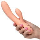 California Dreaming Monterey Magic Dual Action Vibrator held in hand with pink nails, showcasing its design and controls.