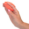 Hand holding Mini Marvels Silicone Marvelous Massager in orange color for discreet pleasure on the go.