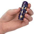 Naughty Bits Just The Tip Bullet Vibrator in hand, showcasing its floral design and compact size.