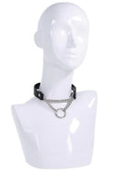 Sex & Mischief Shadow Day Collar displayed on a mannequin, featuring black faux leather and silver-tone O-ring.