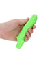 Fluorescent green glow-in-the-dark penis sleeve held in hand, enhancing intimate moments with extra length and girth.