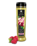 Shunga Organica Kissable Massage Oil Raspberry 8 Oz bottle with raspberries, promotes sensual pleasure and smooth skin.