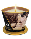 Shunga Massage Candle Excitation 5.7 Oz Chocolate with a soft glowing flame in an elegant jar.