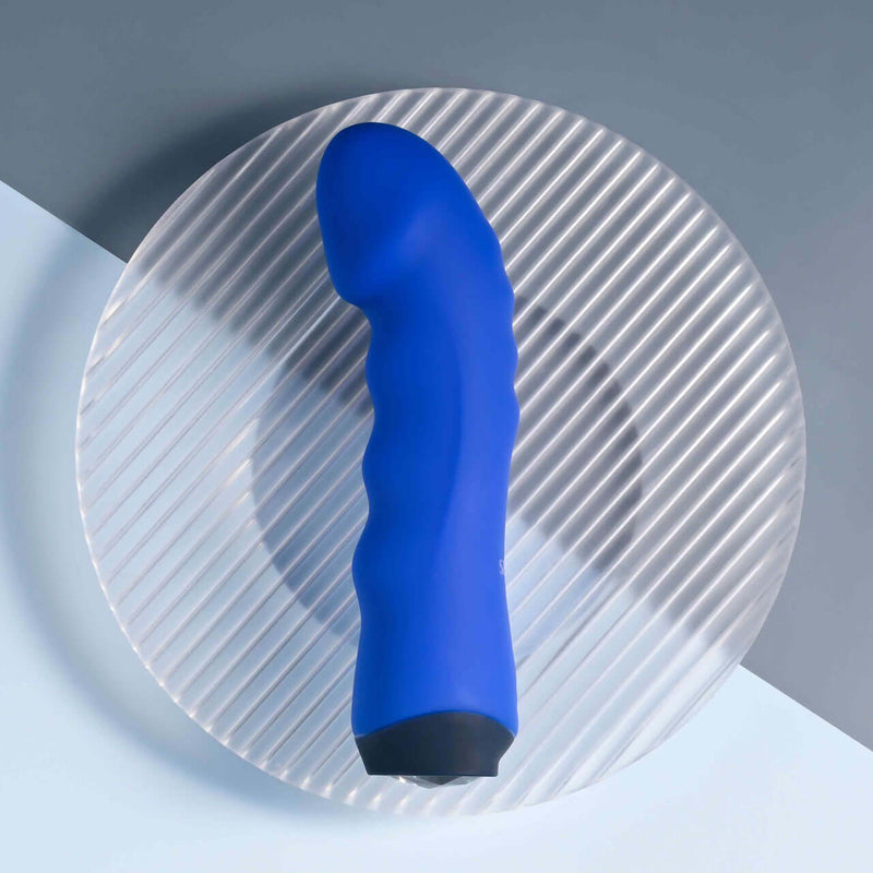 Selopa Blue Banger Petite Vibrator with Curved Head on Glass Plate