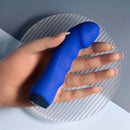Blue Banger Petite Vibrator with curved phallic head and textured shaft in hand, featuring heart-shaped gem control button.