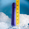 Purple phallic-shaped vibrator with ruler, showcasing size among ice, highlighting the Ambition thrusting vibe's design and features.