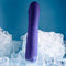 Ambition purple thrusting vibrator with phallic shape surrounded by ice cubes, showcasing 10 speeds and patterns for lifelike stimulation.