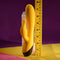 Selopa Buzzz Bunny rechargeable silicone rabbit vibrator in yellow, showcasing its flexible design and size measurement.