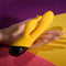 Selopa Buzzz Bunny rechargeable silicone rabbit vibrator in hand, showcasing yellow design and dual motors.