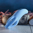 Blue silicone clitoral stimulator with tentacle design, set against a background of shells and stones.