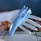 Selopa Tentacle Tickler rechargeable silicone clitoral stimulator in blue, displayed on a hand with seashells.